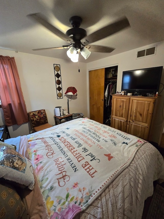 bedroom featuring a closet, a textured ceiling, and ceiling fan