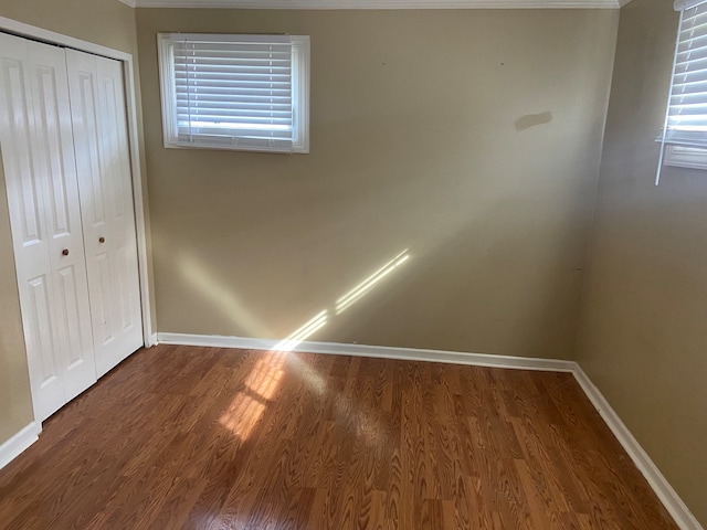 unfurnished bedroom featuring hardwood / wood-style floors