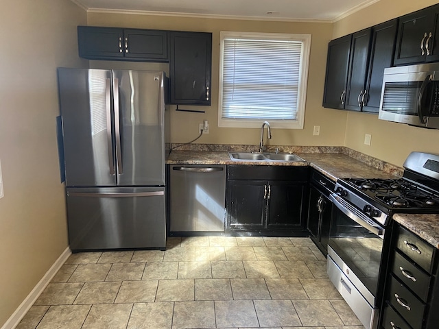 kitchen with appliances with stainless steel finishes, sink, and crown molding