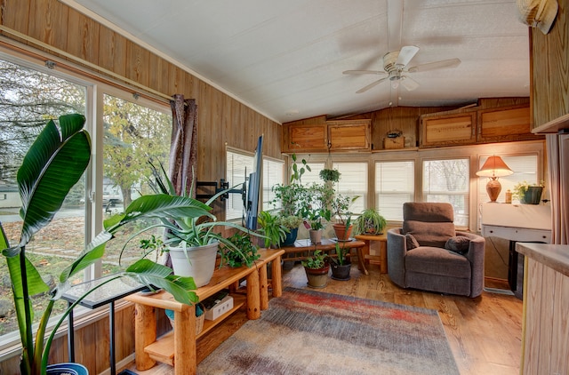 sunroom featuring a wealth of natural light, ceiling fan, and vaulted ceiling