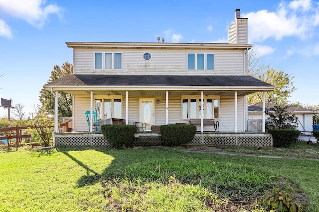 view of front of home with a porch and a front yard