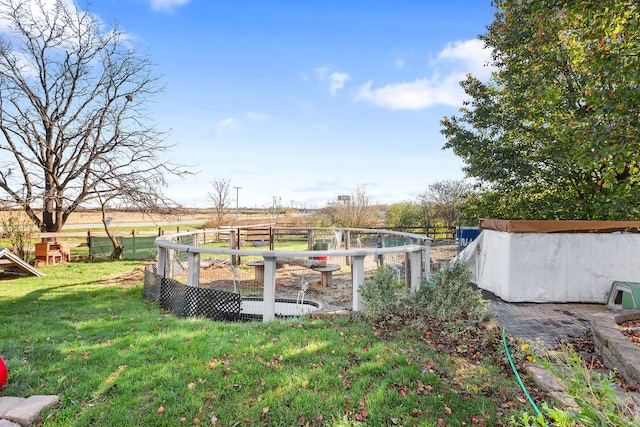 view of yard with a rural view