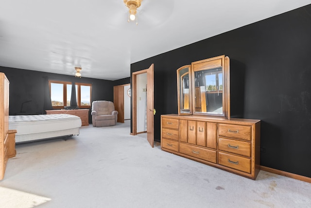 bedroom with light carpet and ceiling fan