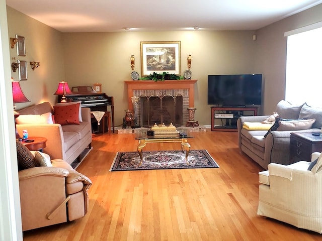 living room featuring hardwood / wood-style floors and a fireplace