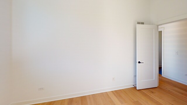 empty room featuring hardwood / wood-style floors