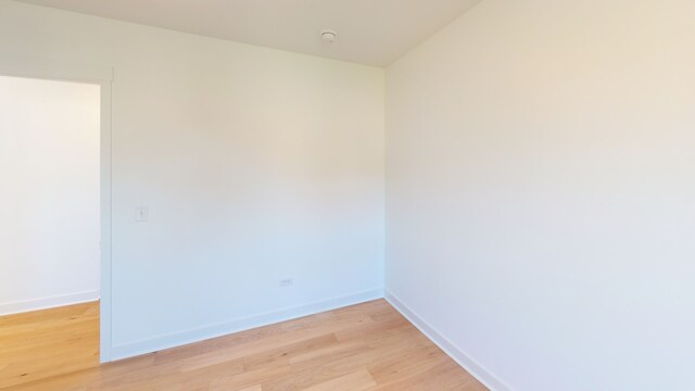 unfurnished room with light hardwood / wood-style flooring