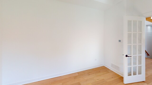 unfurnished room featuring hardwood / wood-style floors