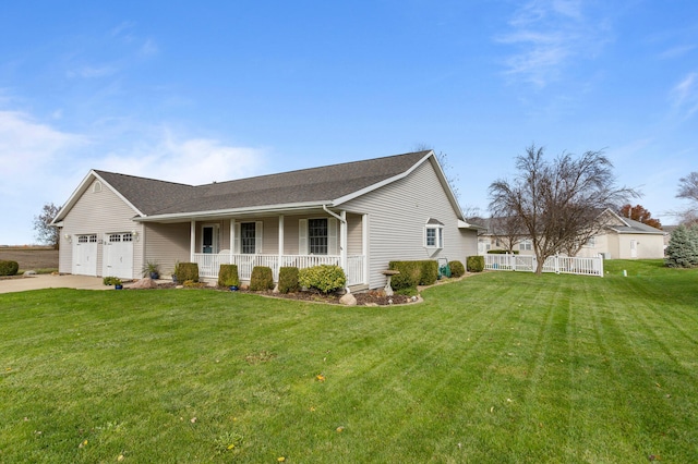 view of front of property featuring a front lawn, covered porch, and a garage