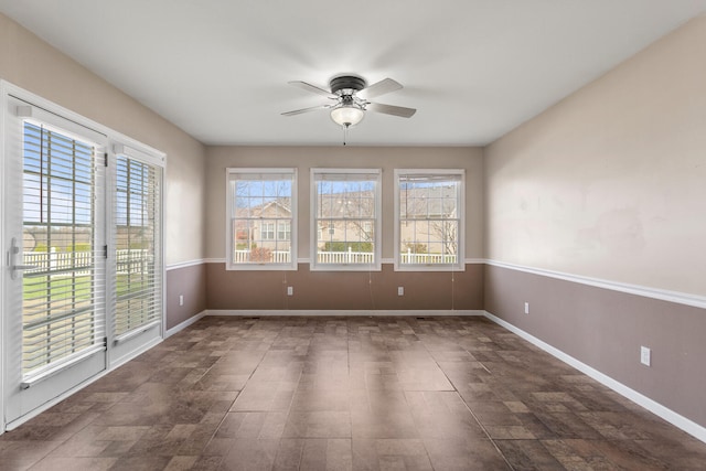 spare room with ceiling fan