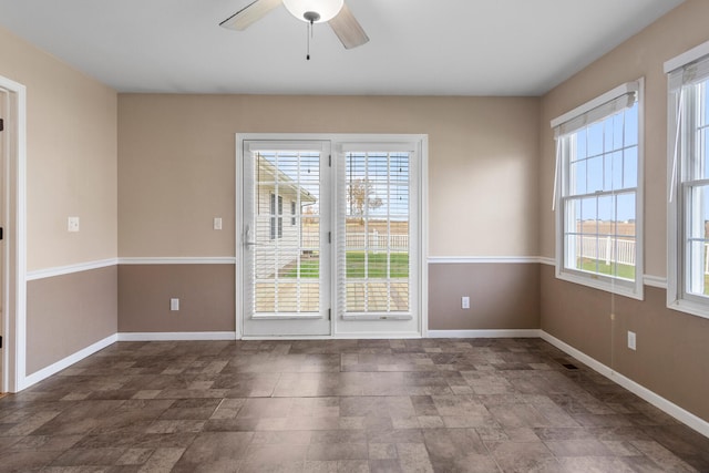 unfurnished room with ceiling fan