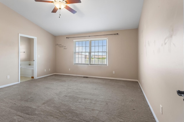 spare room featuring ceiling fan, lofted ceiling, and carpet floors