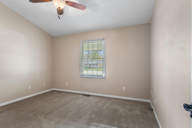 empty room featuring carpet flooring and ceiling fan