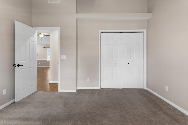 unfurnished bedroom featuring a closet and carpet floors