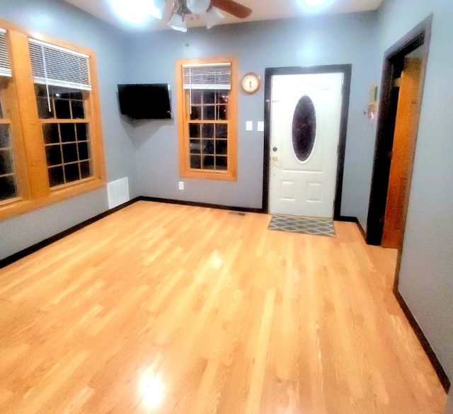 entrance foyer with ceiling fan and light hardwood / wood-style floors