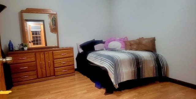 bedroom featuring light wood-style floors