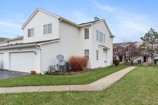 view of property exterior with a garage and a lawn