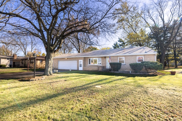 ranch-style house with a front lawn and a garage