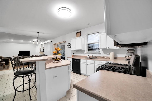 kitchen featuring dishwasher, a breakfast bar, white cabinets, and gas stove