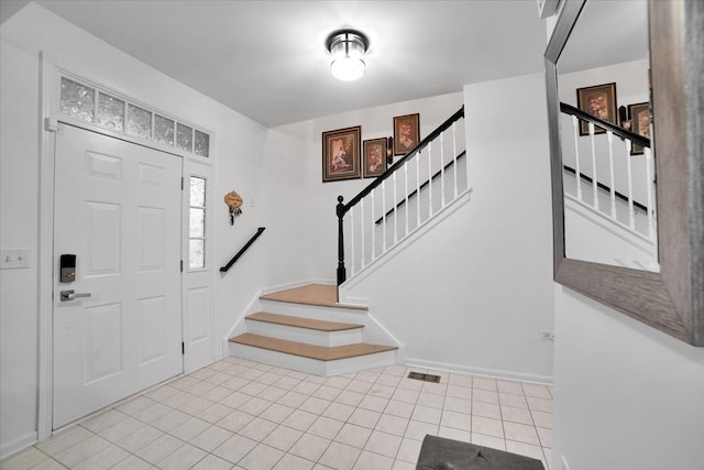 entrance foyer featuring light tile patterned floors