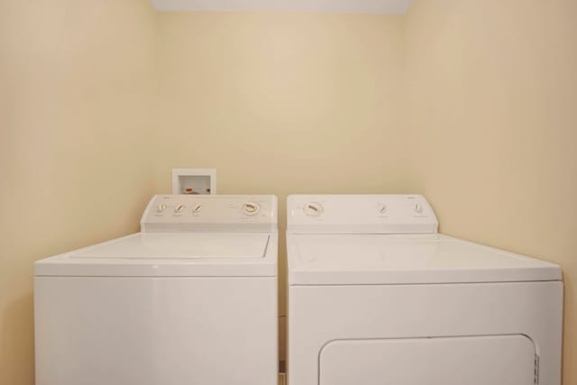 clothes washing area featuring washing machine and clothes dryer