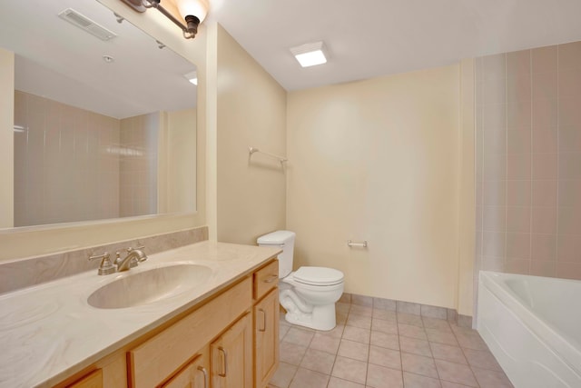 full bathroom with vanity, tile patterned floors, toilet, and tiled shower / bath combo