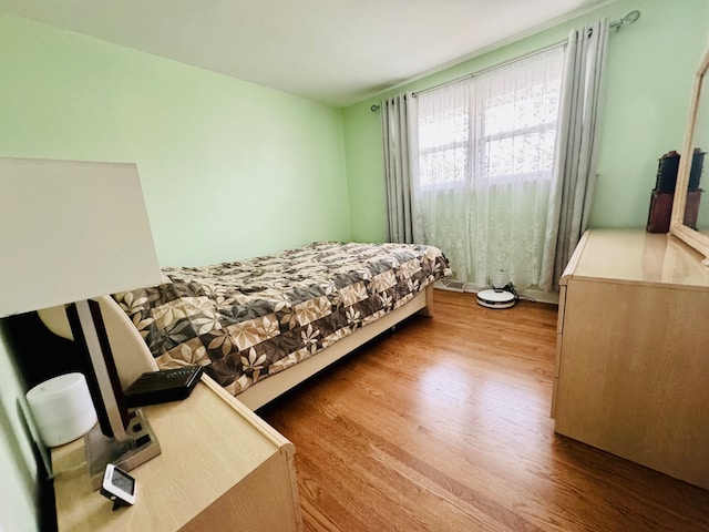 bedroom with light wood-type flooring