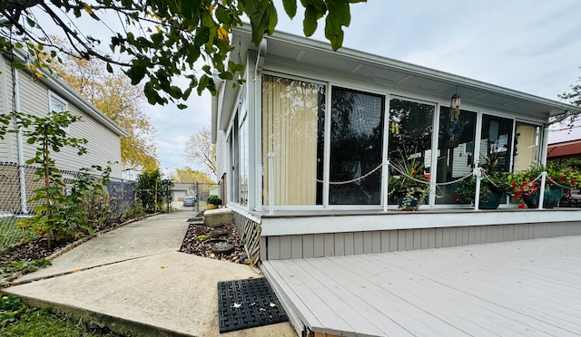 view of side of property featuring a deck