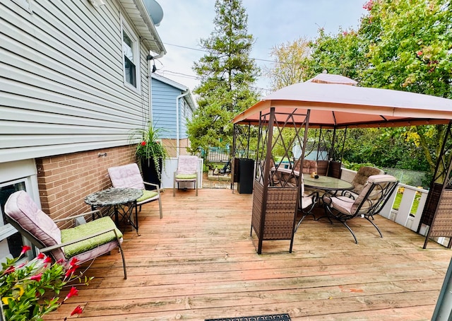 wooden deck featuring a gazebo