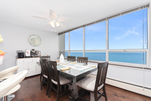 dining area featuring a water view, a baseboard radiator, dark hardwood / wood-style floors, and ceiling fan