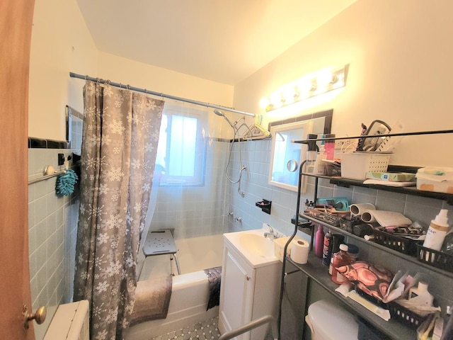 1100 N Harlem Ave Unit 1, River Forest, IL 60305 - bathroom with tile walls, shower / tub combo with curtain, toilet, a wainscoted wall, and vanity