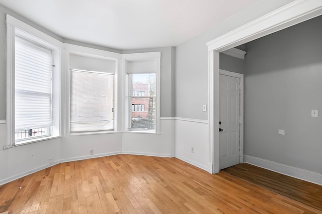 6317 S Eberhart Ave, Chicago, IL 60637 - empty room with light wood finished floors and baseboards