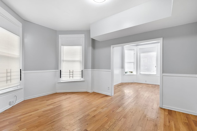 spare room with light hardwood / wood-style flooring