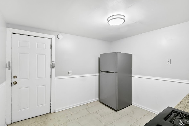 kitchen featuring stainless steel fridge