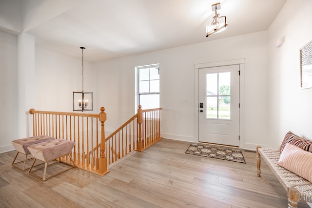 foyer featuring light hardwood / wood-style floors and a chandelier