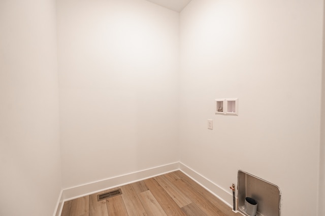 laundry room featuring light hardwood / wood-style flooring, washer hookup, and gas dryer hookup