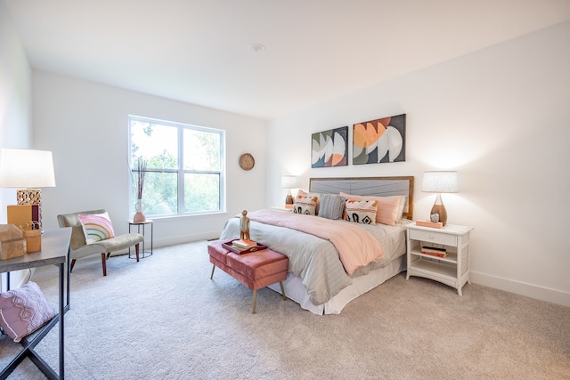 bedroom featuring light colored carpet