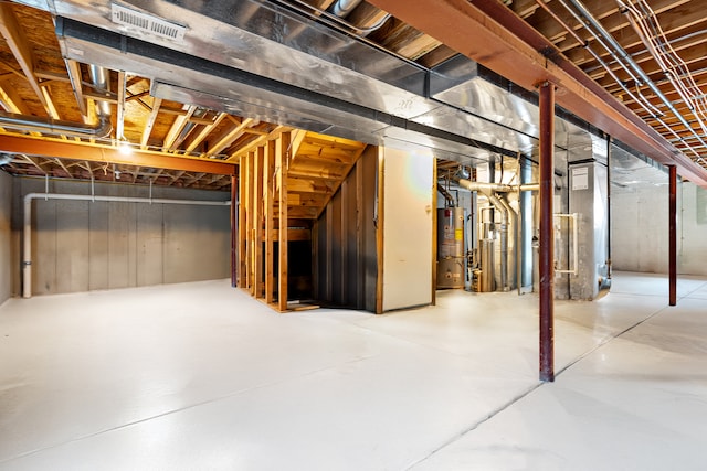 basement with gas water heater and heating unit