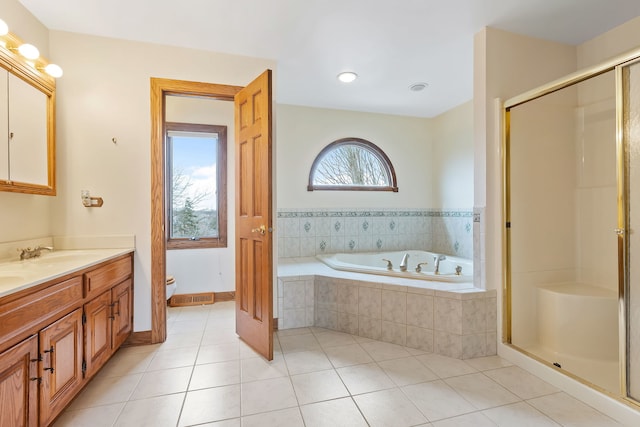 full bathroom featuring tile patterned floors, toilet, separate shower and tub, and vanity