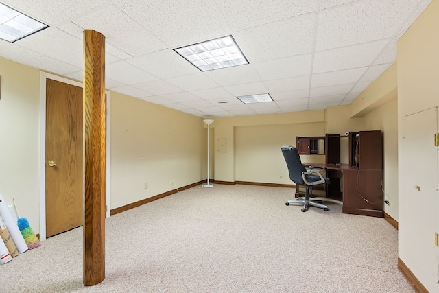 office space with light carpet and a drop ceiling