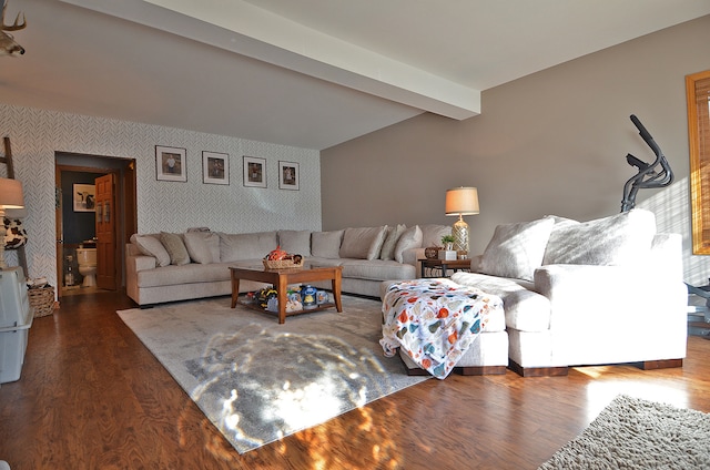 living room featuring dark wood-type flooring and beamed ceiling