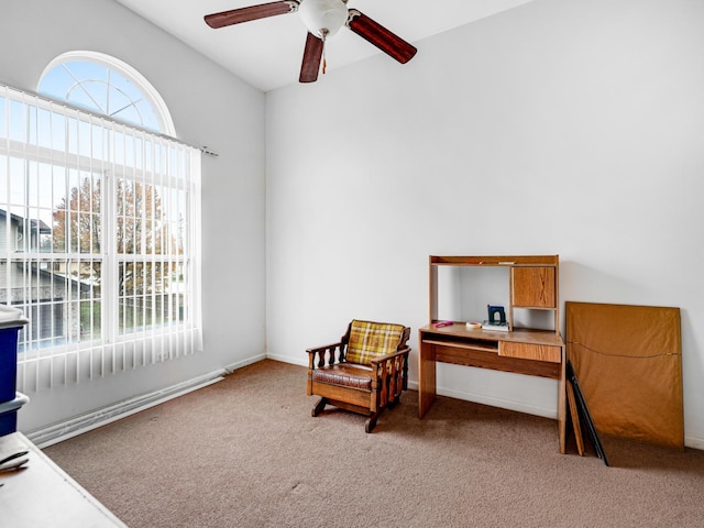 living area featuring ceiling fan, carpet, and vaulted ceiling