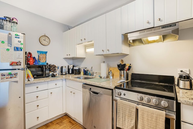 kitchen featuring sink, white cabinetry, stainless steel appliances, and light parquet floors