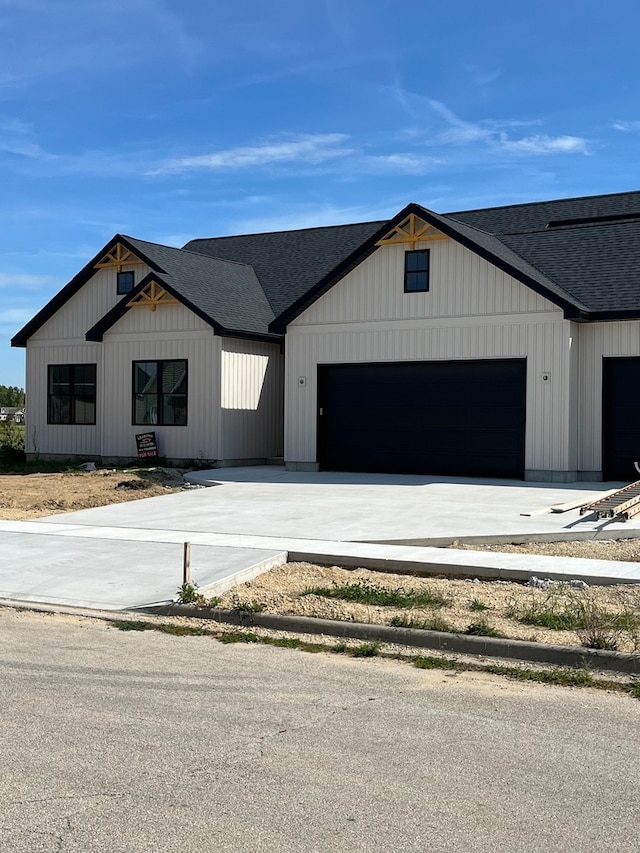 modern inspired farmhouse featuring a garage