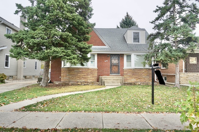 view of front of property with cooling unit and a front lawn