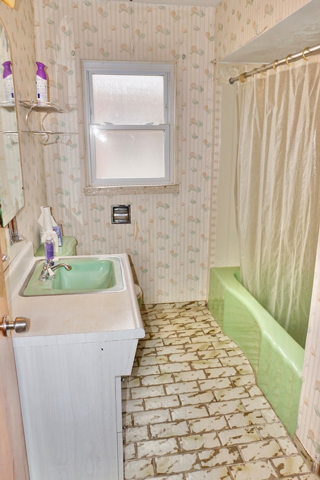 bathroom with vanity and shower / bath combo with shower curtain