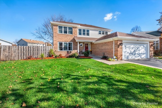 front of property with a front yard and a garage