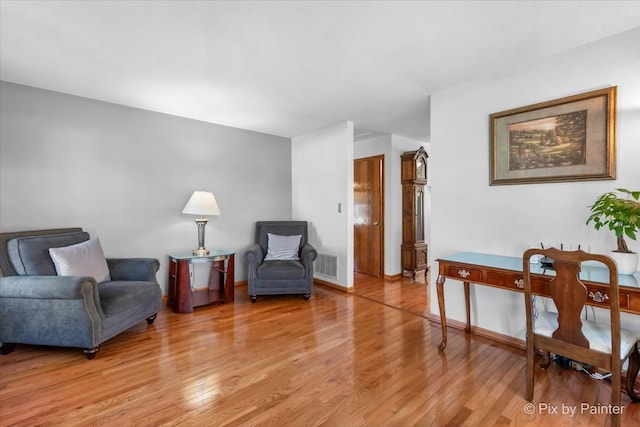 sitting room with light hardwood / wood-style flooring