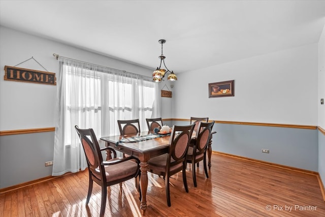 dining area featuring light wood-type flooring