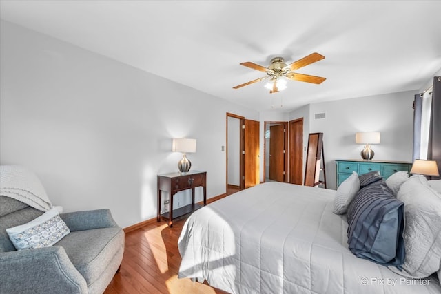 bedroom with ceiling fan and light wood-type flooring