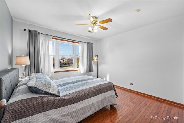 bedroom featuring wood-type flooring and ceiling fan